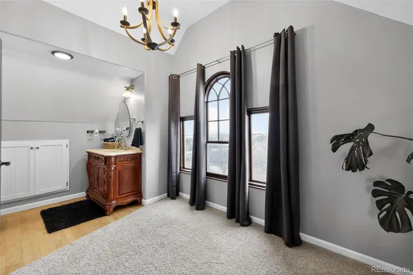 a view of a bathroom with a bathtub and shower