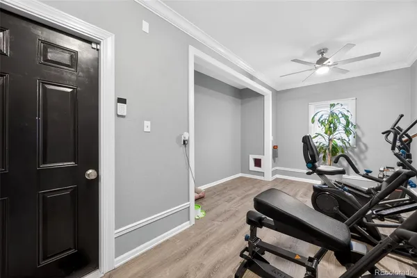 a view of a workspace with furniture and wooden floor