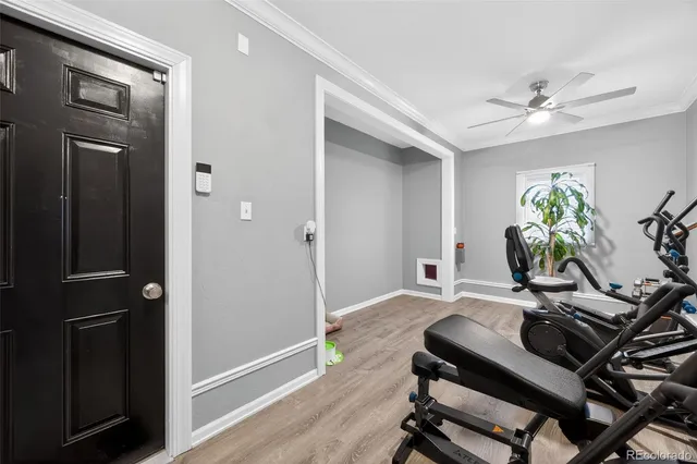 a view of a workspace with furniture and wooden floor