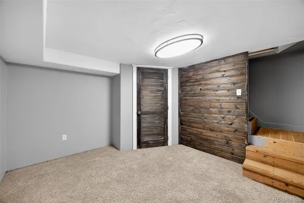 a view of an empty room and fire place