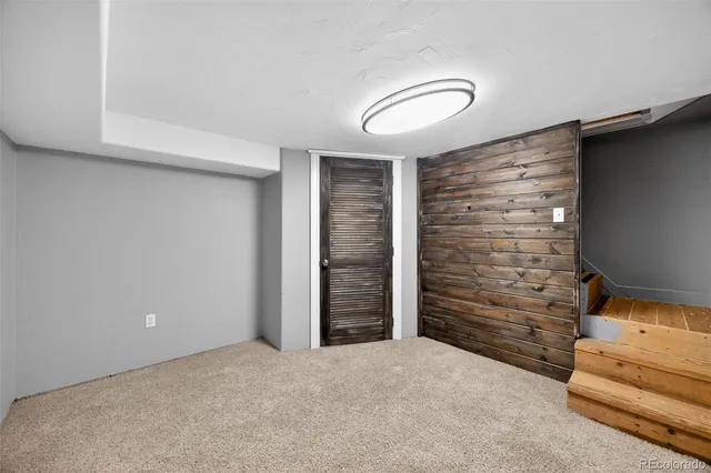 a view of an empty room and fire place