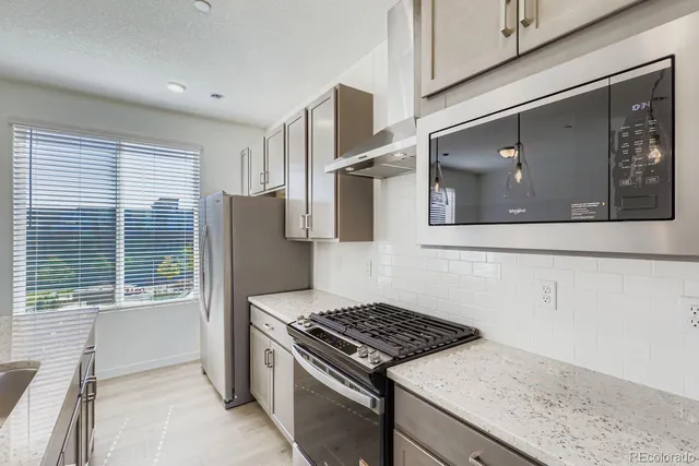 a kitchen with a stove and a microwave