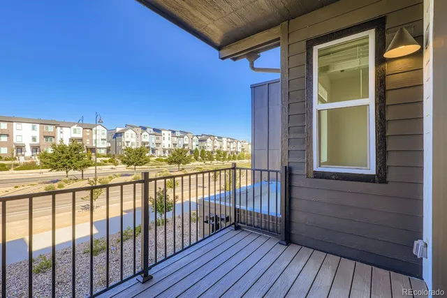 a view of a balcony with wooden floor