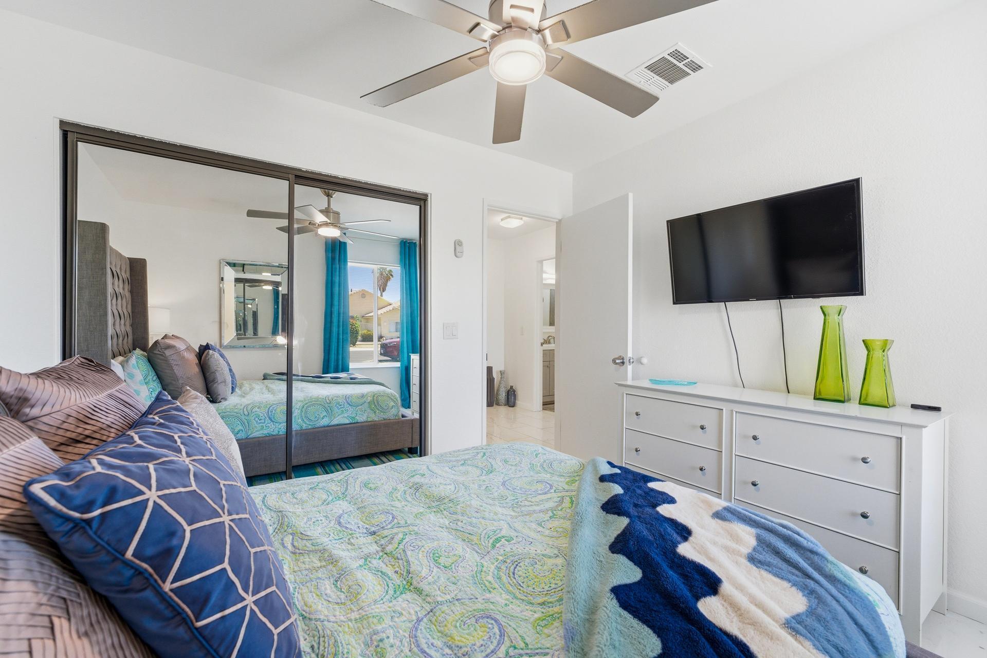 67220 Quijo Road Cathedral City, CA 92234 - Photo 12 of 26 a bedroom with furniture and a flat screen tv