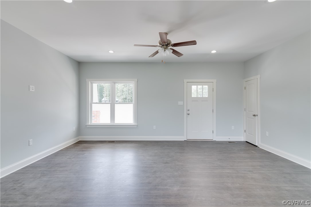 1219 Deep Run Road Cartersville, VA 23027 - Photo 6 of 26 an empty room with wooden floor and windows
