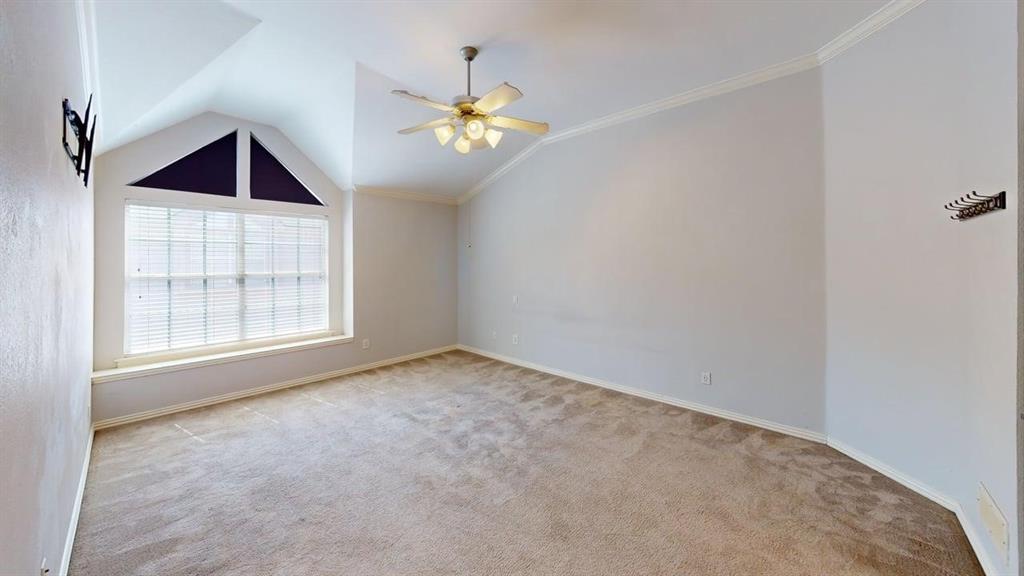 18240 Midway Road, Unit 1204 Dallas, TX 75287 - Photo 16 of 27 an empty room with chandelier fan and windows