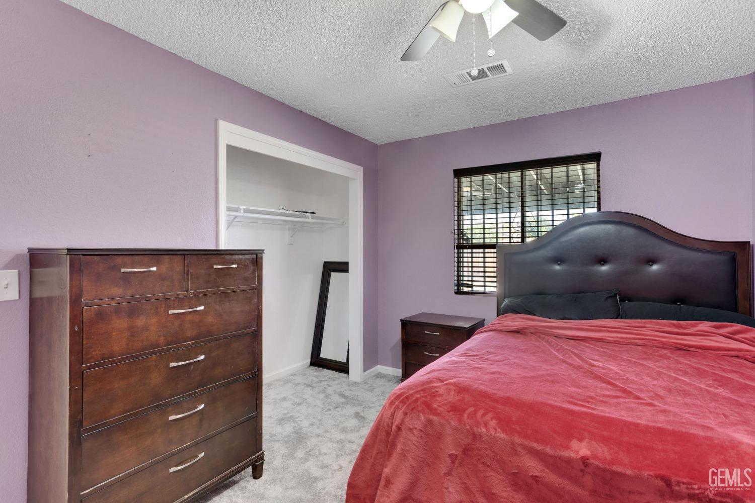 Undisclosed Address Bakersfield, CA 93307 - Photo 31 of 42 a bedroom with a bed and a dresser