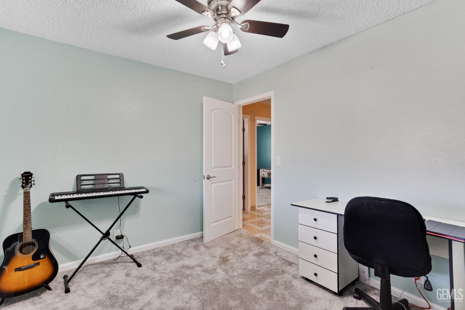 Undisclosed Address Bakersfield, CA 93307 - Photo 34 of 42 a room with a fan and gym equipment