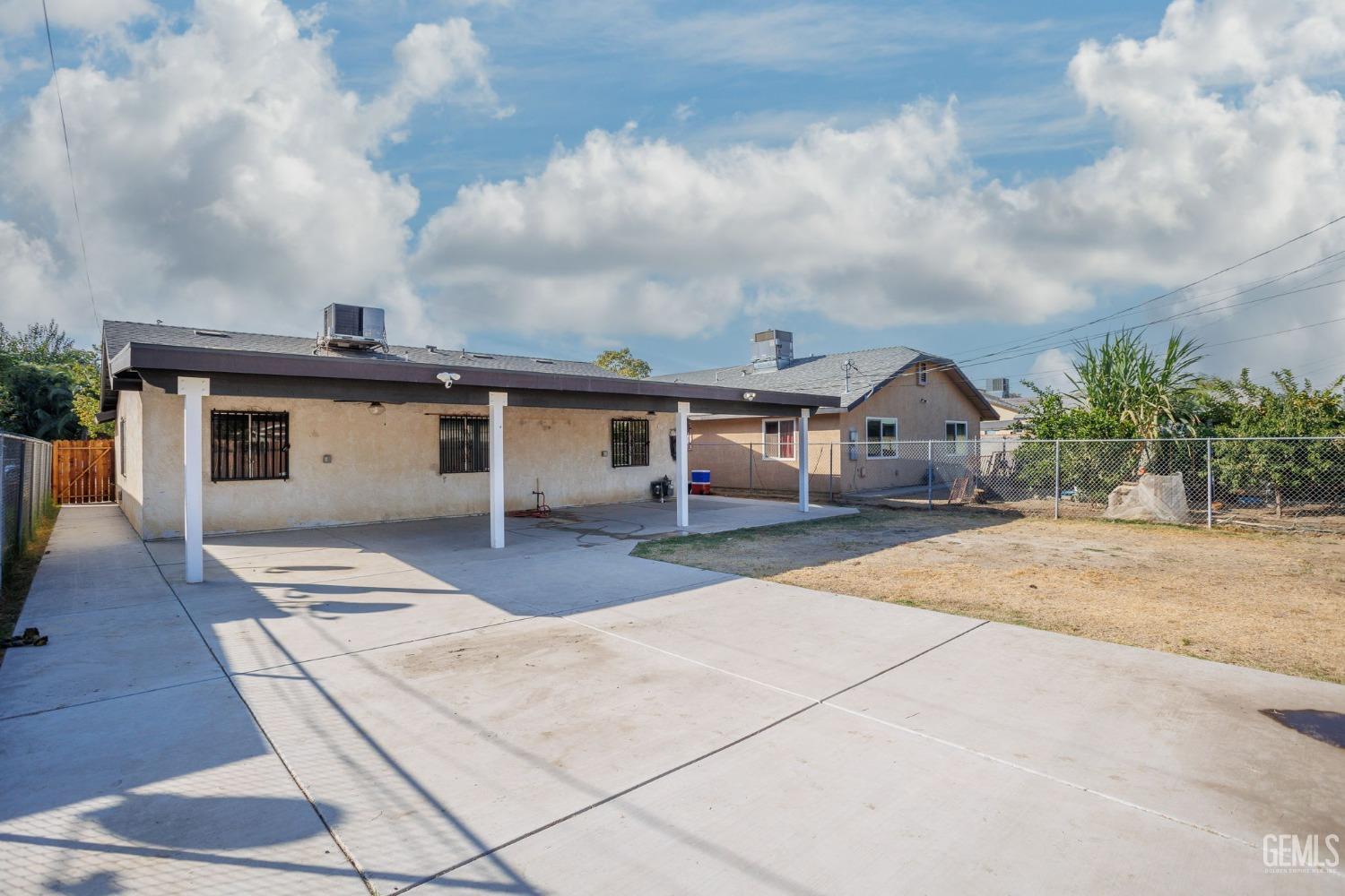 Undisclosed Address Bakersfield, CA 93307 - Photo 37 of 42 a front view of a house with garden