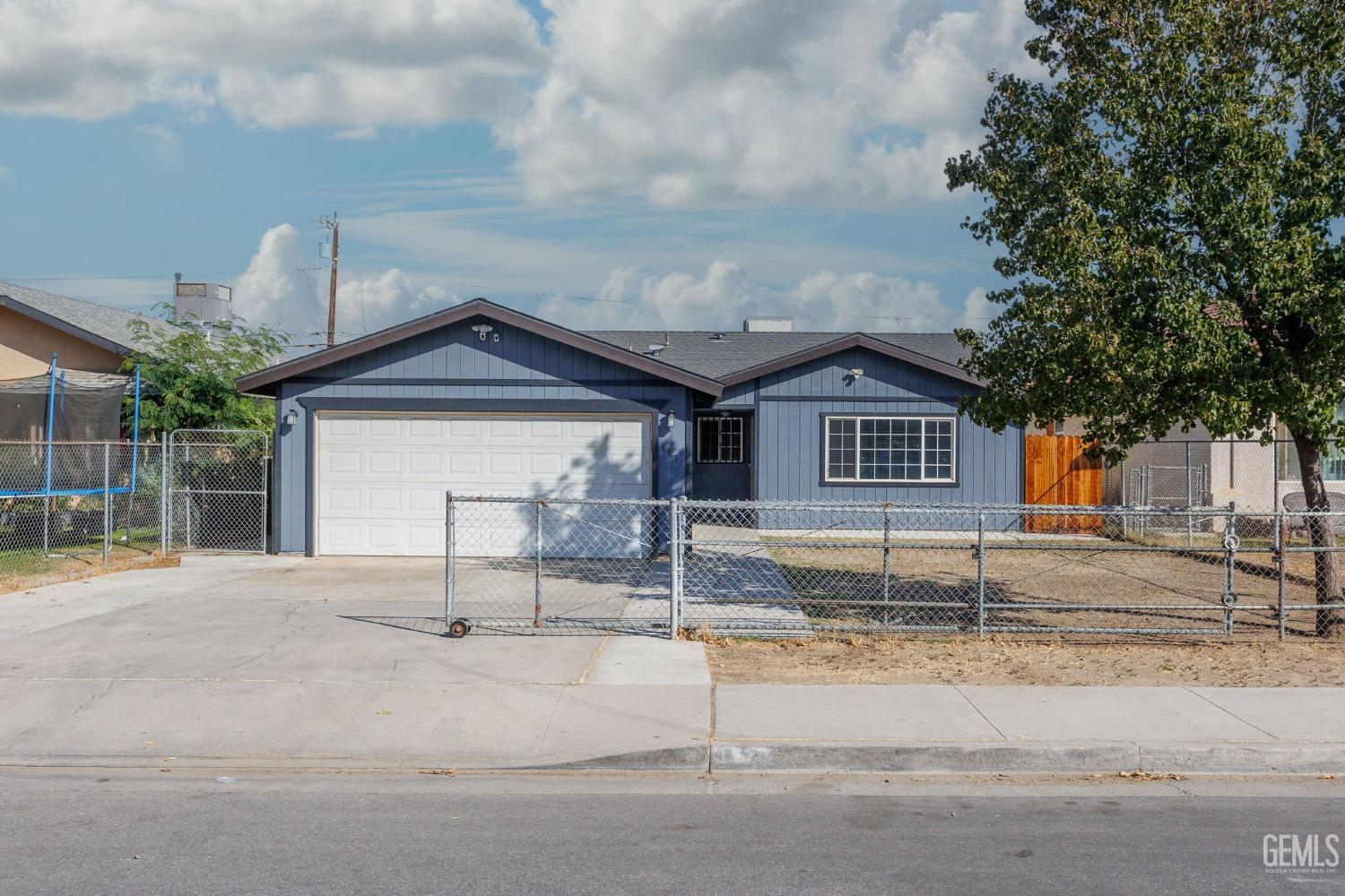 Undisclosed Address Bakersfield, CA 93307 - Photo 6 of 42 a house view with a outdoor space