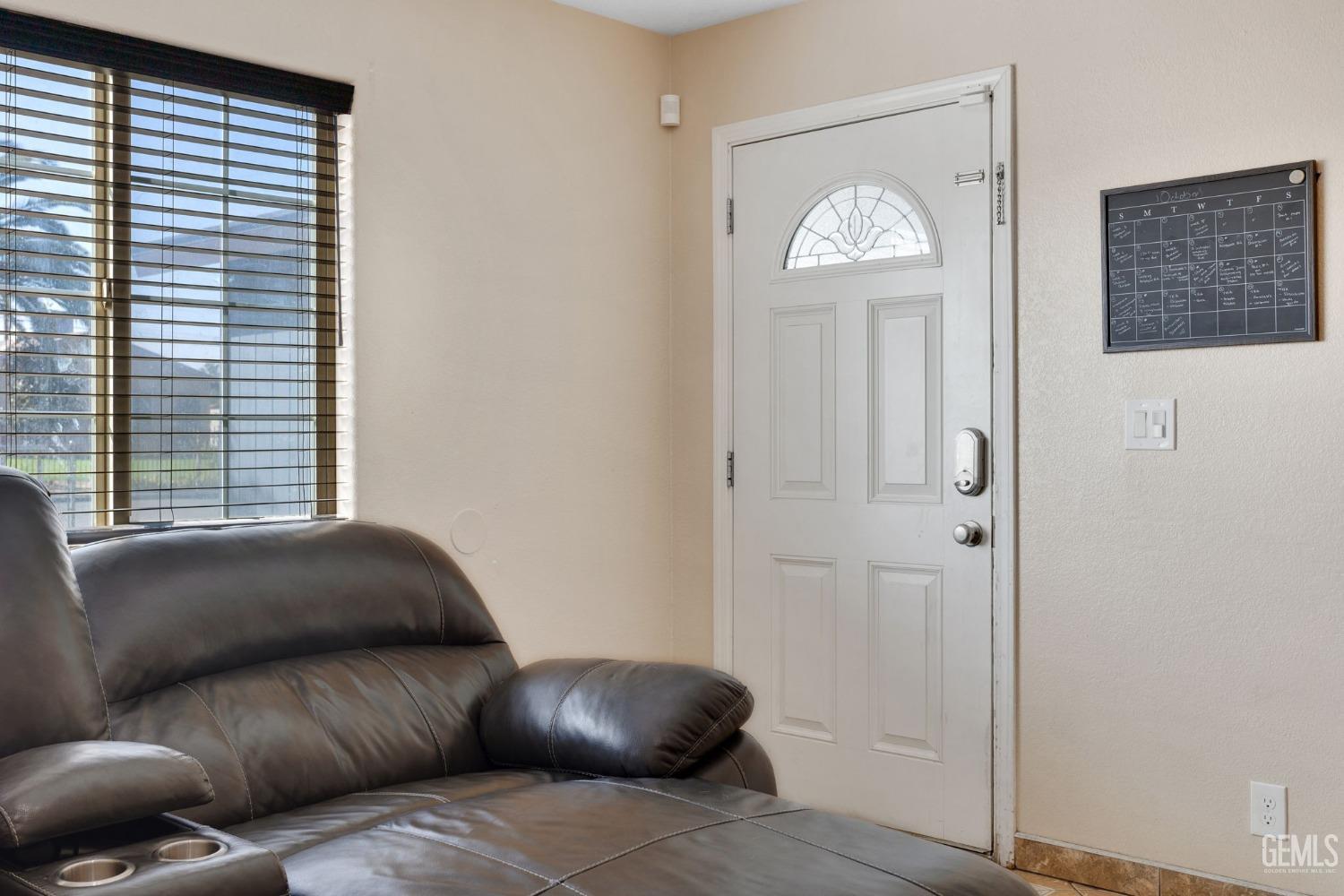 Undisclosed Address Bakersfield, CA 93307 - Photo 10 of 42 a living room with furniture and a window