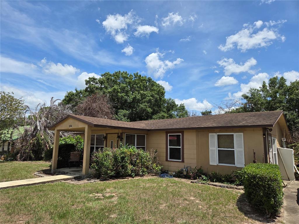 124 East F Street Frostproof, FL 33843 - Photo 32 of 37 a front view of house with yard and green space
