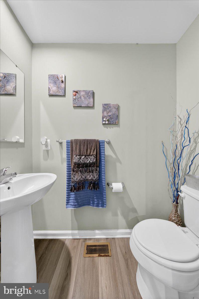2 Ridgely Forest Drive Elkton, MD 21921 - Photo 12 of 35 a white toilet sitting next to a bathroom sink