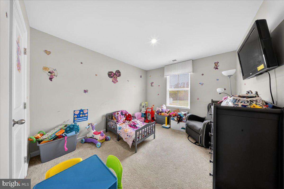2 Ridgely Forest Drive Elkton, MD 21921 - Photo 22 of 35 a bedroom with furniture and a flat screen tv