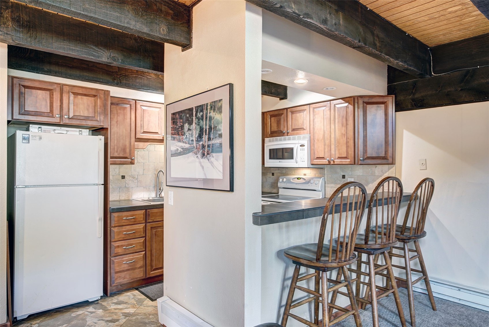 78 Guller Road, Unit 301 Copper Mountain, CO 80443 - Photo 10 of 41 With additional seating for three at the kitchen bar, there is ample space for everyone in this condo.