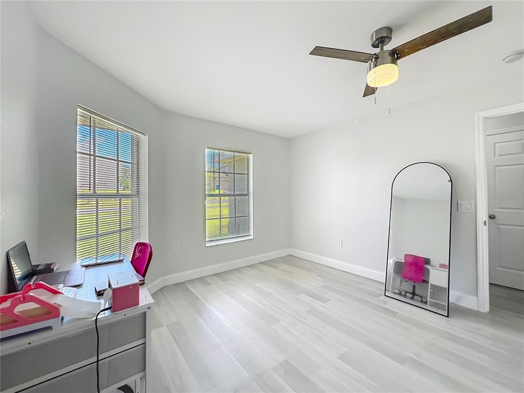12368 Killian Street Spring Hill, FL 34609 - Photo 18 of 25 a living room with furniture and a window