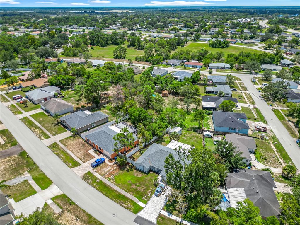 12368 Killian Street Spring Hill, FL 34609 - Photo 24 of 25 an aerial view of residential houses with outdoor space