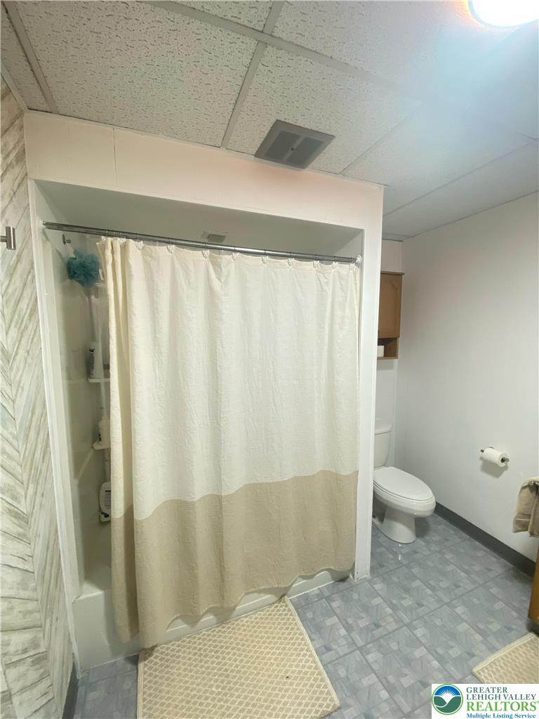 207 Chestnut Street Slatington, PA 18080 - Photo 14 of 26 a bathroom with a toilet and shower