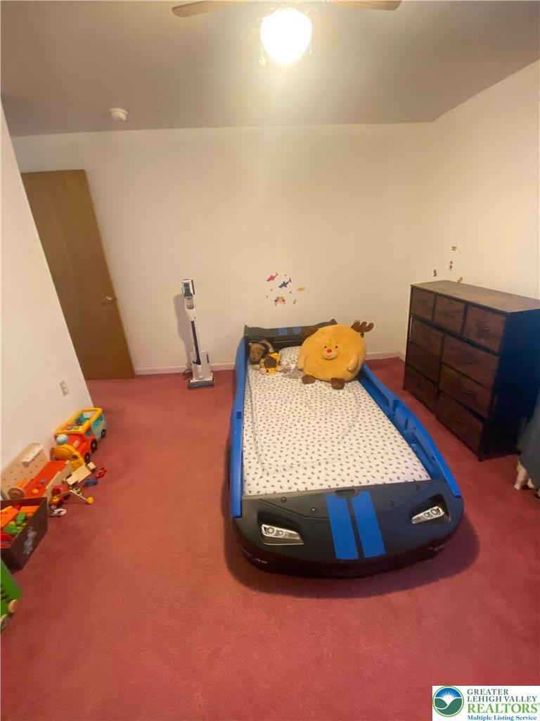 207 Chestnut Street Slatington, PA 18080 - Photo 16 of 26 a bedroom with a bed and wooden floor