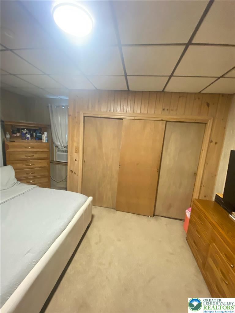 207 Chestnut Street Slatington, PA 18080 - Photo 18 of 26 a bedroom with a bed and wooden floor