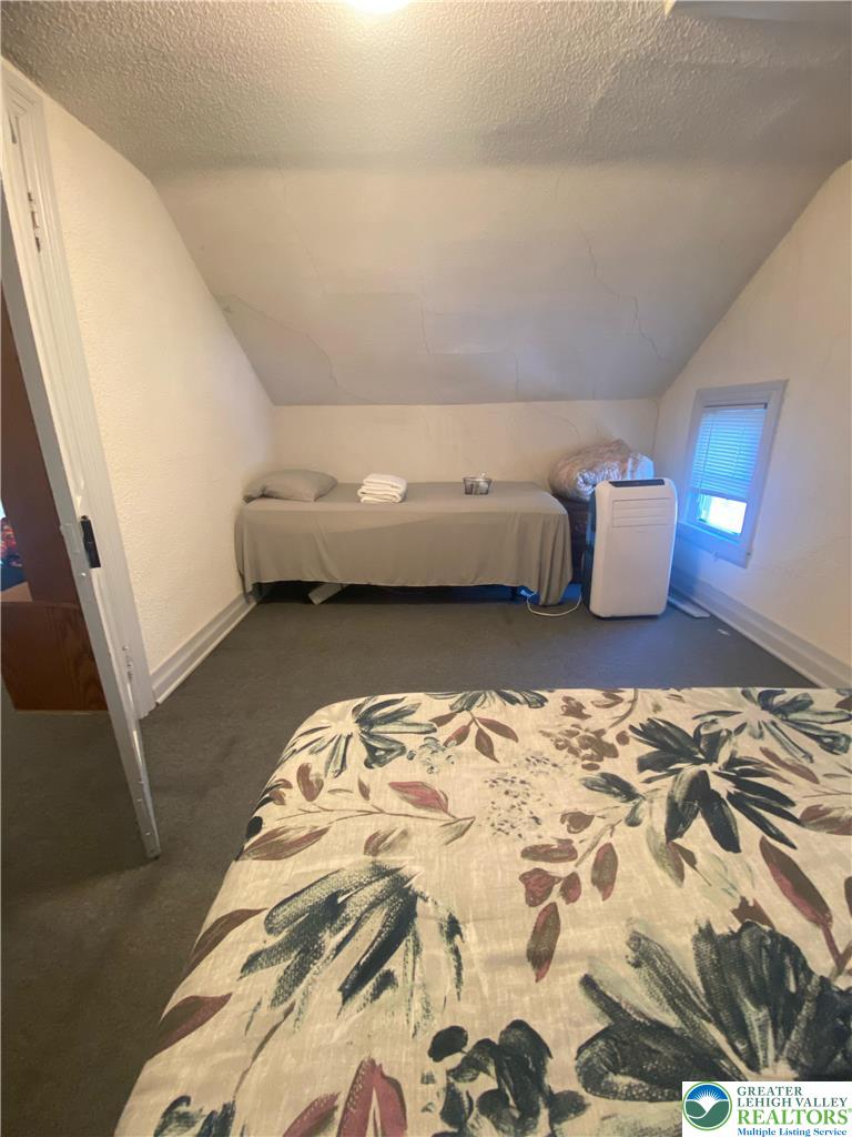 207 Chestnut Street Slatington, PA 18080 - Photo 23 of 26 a bedroom with a bed and window