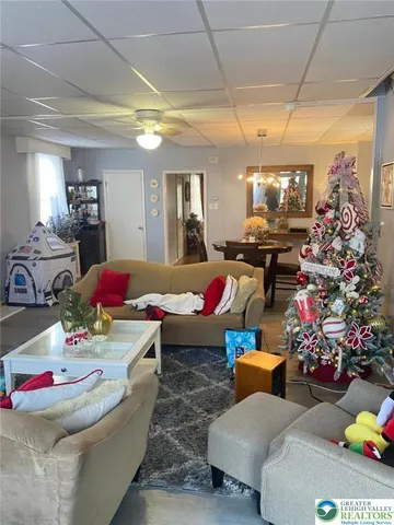 a room with furniture and a chandelier