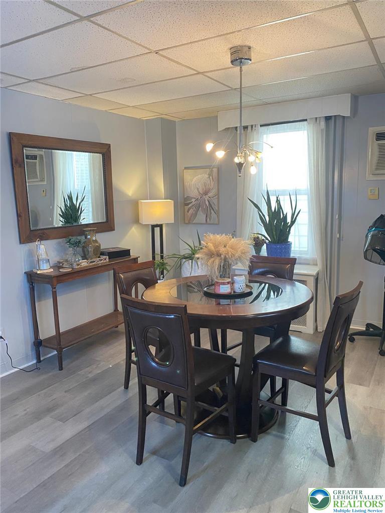 207 Chestnut Street Slatington, PA 18080 - Photo 8 of 26 a dining room with furniture a chandelier and wooden floor