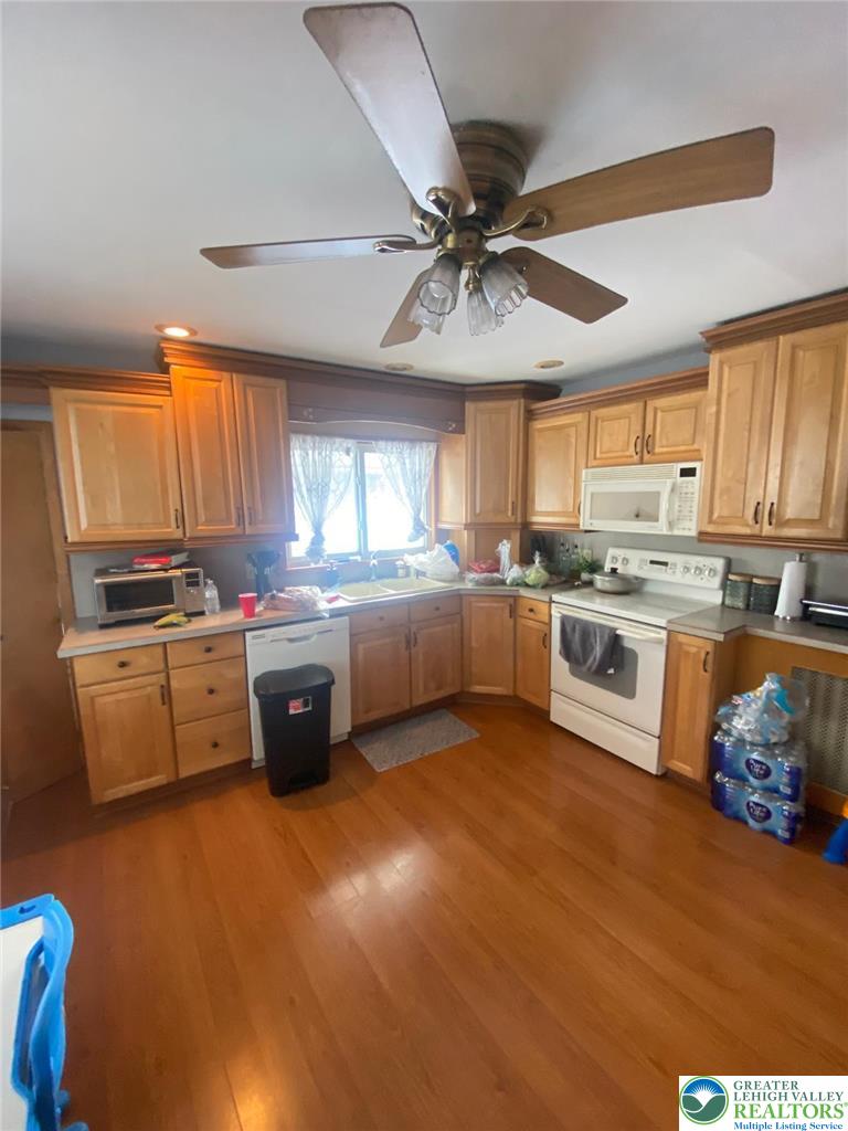 207 Chestnut Street Slatington, PA 18080 - Photo 10 of 26 a kitchen with stainless steel appliances a sink window and cabinets