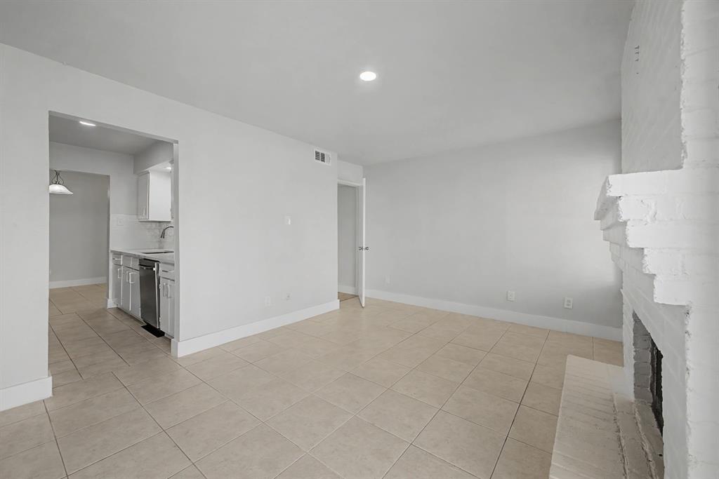 8095 Meadow Road, Unit 236 Dallas, TX 75231 - Photo 14 of 25 wooden floor in a room with a kitchen