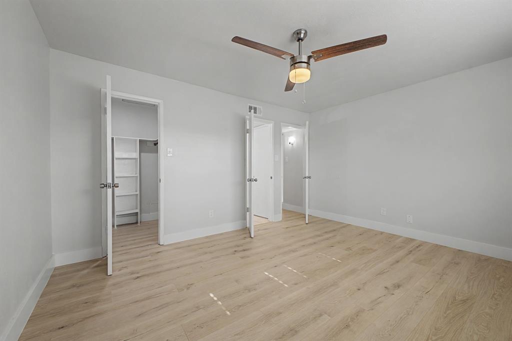 8095 Meadow Road, Unit 236 Dallas, TX 75231 - Photo 20 of 25 wooden floor in an empty room