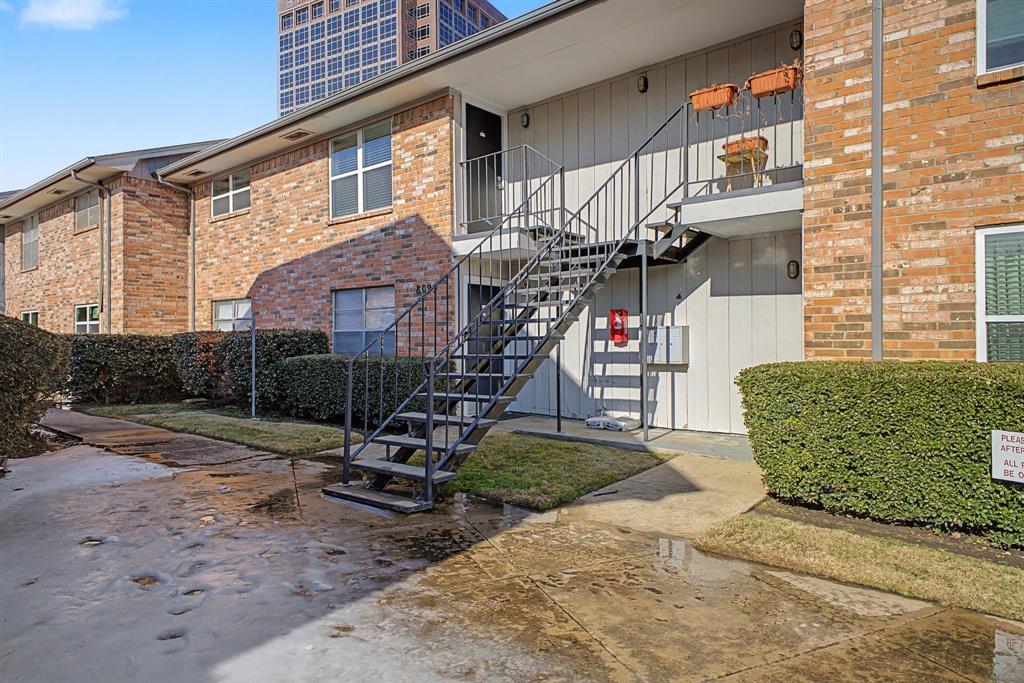8095 Meadow Road, Unit 236 Dallas, TX 75231 - Photo 2 of 25 a front view of a house with garden