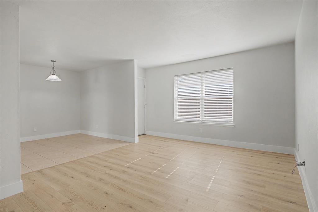8095 Meadow Road, Unit 236 Dallas, TX 75231 - Photo 7 of 25 a view of an empty room with a window