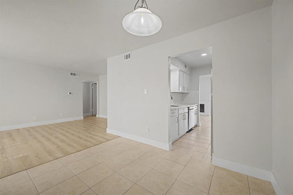 8095 Meadow Road, Unit 236 Dallas, TX 75231 - Photo 10 of 25 a view of a kitchen with a sink and cabinets