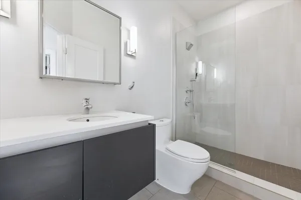 a bathroom with a sink a toilet and vanity