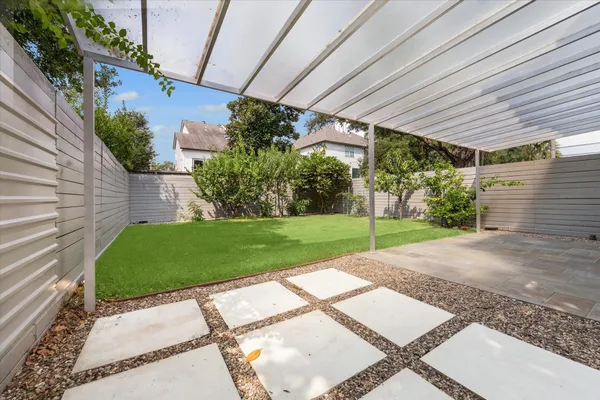 a view of a backyard with plants and garden