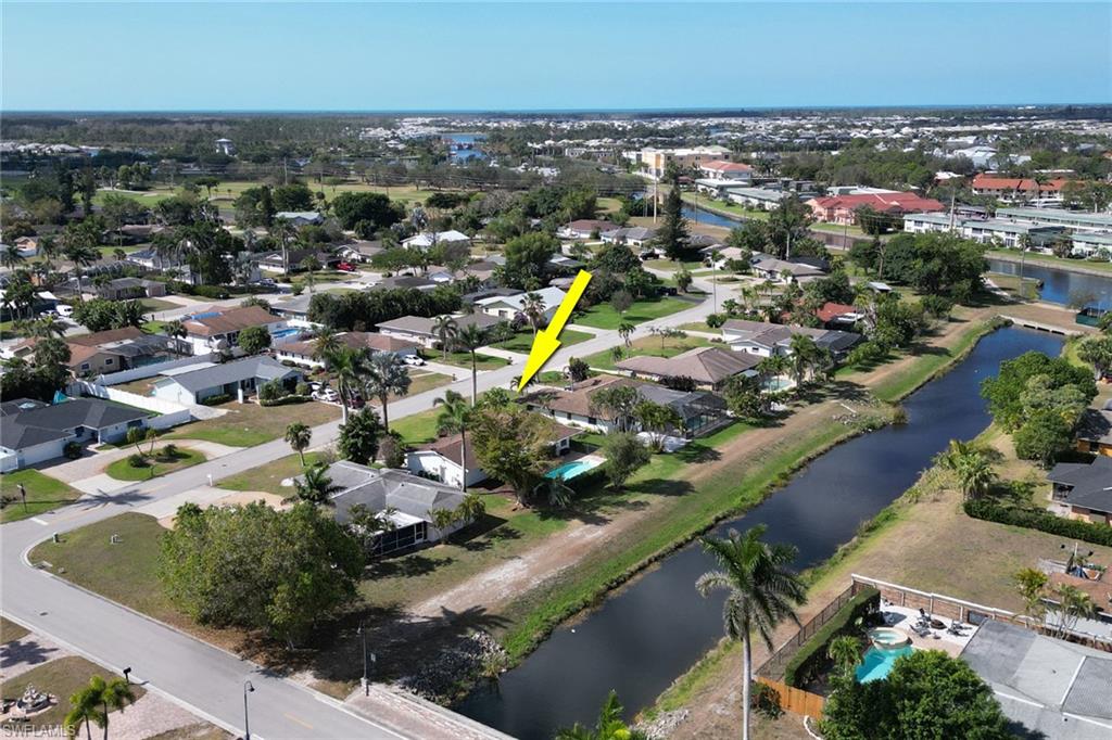 103 Doral Circle Naples, FL 34113 - Photo 22 of 25 an aerial view of a city with lots of residential buildings