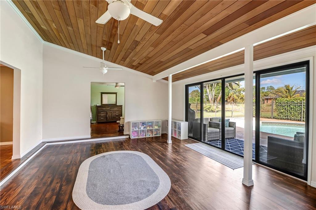 103 Doral Circle Naples, FL 34113 - Photo 8 of 25 a very nice looking room with a large window