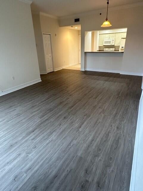 4610 PGA Boulevard, Unit 305 Palm Beach Gardens, FL 33418 - Photo 9 of 10 wooden floor in an empty room with a window