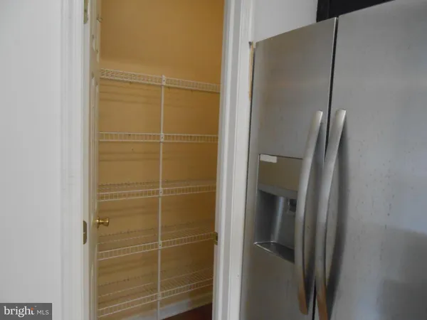 a bathroom with a glass door shower and a sink
