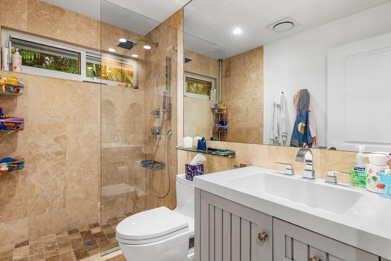 17844 Scarsdale Way Boca Raton, FL 33496 - Photo 23 of 38 a bathroom with a sink a toilet and shower