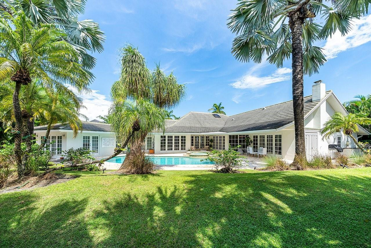 17844 Scarsdale Way Boca Raton, FL 33496 - Photo 25 of 38 a front view of a house with garden and trees