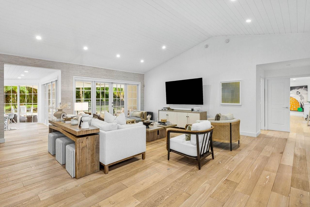 17844 Scarsdale Way Boca Raton, FL 33496 - Photo 5 of 38 a living room with furniture flat screen tv and wooden floor