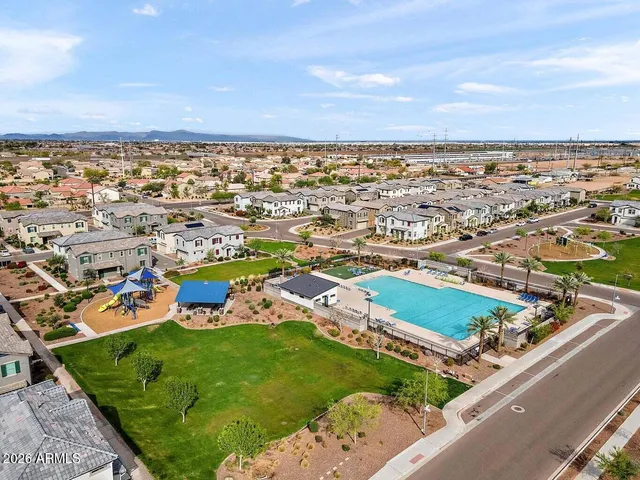 an aerial view of residential houses with outdoor space