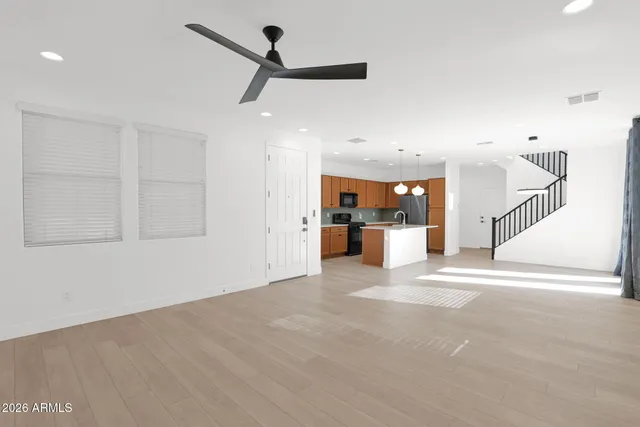 a view of a kitchen with a sink and a window