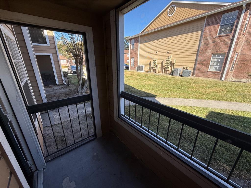 5500 Devonbriar Way, Unit 104 Orlando, FL 32822 - Photo 17 of 24 a view of balcony with wooden floor