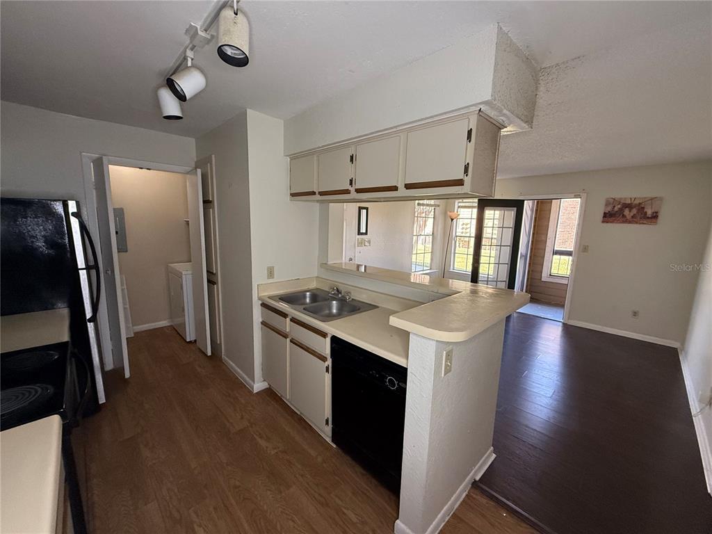 5500 Devonbriar Way, Unit 104 Orlando, FL 32822 - Photo 8 of 24 a kitchen with stainless steel appliances granite countertop a refrigerator a stove and a refrigerator