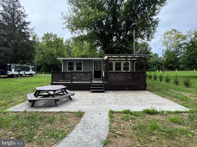 a view of a dirt road and trees