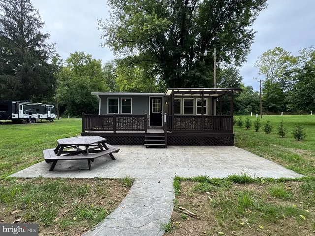 a view of deck with wooden floor and outdoor seating