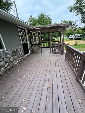 a view of deck with wooden floor and outdoor seating