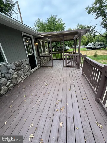 a view of a patio with wooden floor